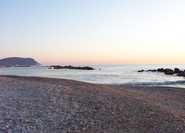 Daggry på Porto Recanatis strand